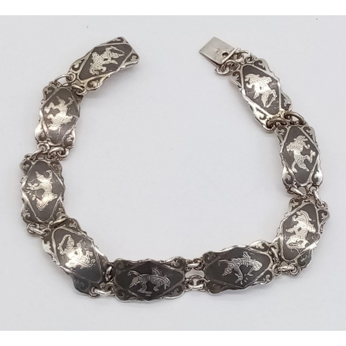 1206 - A vintage sterling silver Siam link bracelet. Total weight 9.7G. Total length 18cm.