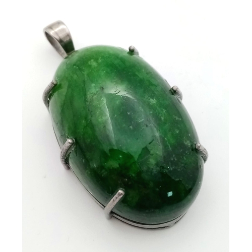 1149 - A Large Emerald Cabochon Pendant set in 925 Sterling Silver. 153.20ct. W- 36.50g. Comes in a present... 