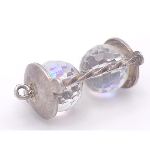 1130 - A sterling silver charm in the shape of an hour glass. Height: 26 mm, weight: 5.3 g.