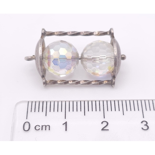 1130 - A sterling silver charm in the shape of an hour glass. Height: 26 mm, weight: 5.3 g.