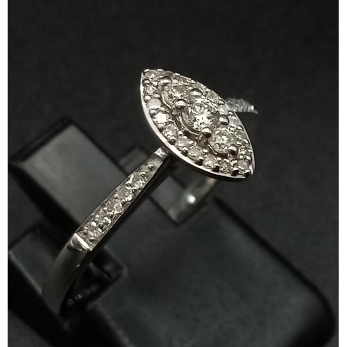 1131 - A 9K WHITE GOLD MARQUISE SHAPED DIAMOND CLUSTER RING. 0.20CT DIAMONDS. TOTAL WEIGHT 1.6 GRAMS. RING ... 