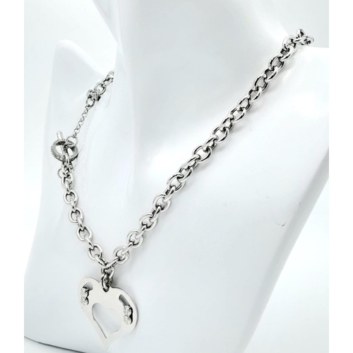 1051 - A Sterling Silver Heart Pendant on a Silver Chain. 3cm pendant. 46cm chain. 22g total weight.