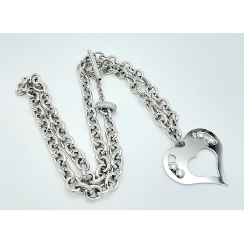 1051 - A Sterling Silver Heart Pendant on a Silver Chain. 3cm pendant. 46cm chain. 22g total weight.