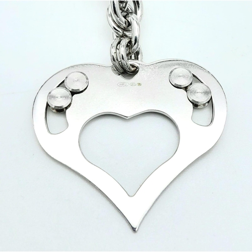 1051 - A Sterling Silver Heart Pendant on a Silver Chain. 3cm pendant. 46cm chain. 22g total weight.