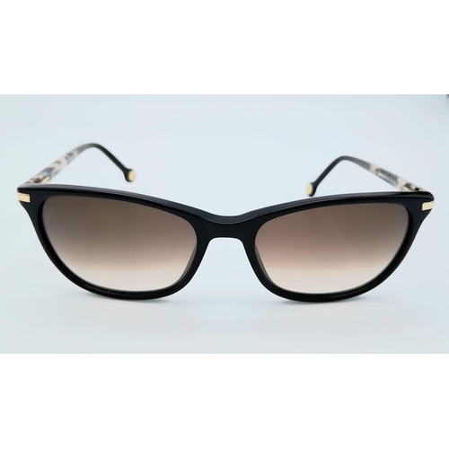 1075 - A Pair of Designer Carolina Herrera Sunglasses. Good condition.