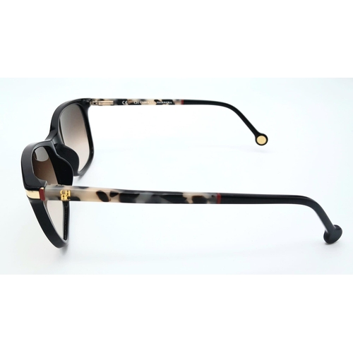 1075 - A Pair of Designer Carolina Herrera Sunglasses. Good condition.