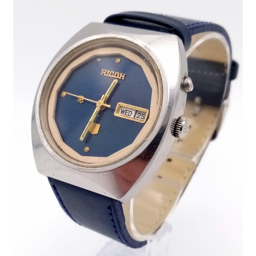 1060 - A Vintage Ricoh Automatic Gents Watch. Blue leather strap. Stainless steel case - 37mm. Blue dial wi... 