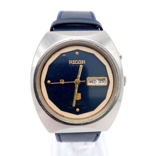 1060 - A Vintage Ricoh Automatic Gents Watch. Blue leather strap. Stainless steel case - 37mm. Blue dial wi... 