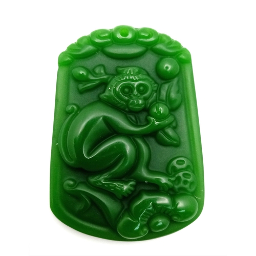 1054 - A Decorative Monkey Green Jade Pendant. 4cm x 3cm