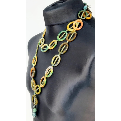 1040 - A Unique Rope Length Oval Multi-Coloured Agate Necklace.
130cm. Ref: T1R