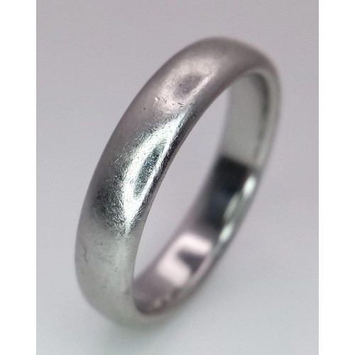 100 - A Tiffany and Co Platinum 4mm rounded band ring. 9.3g. Size Q.