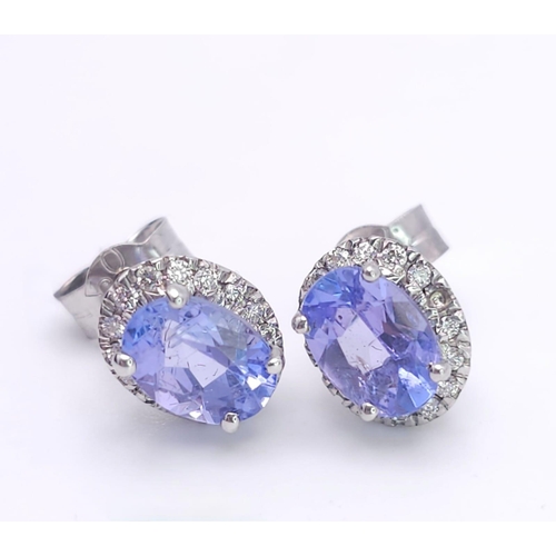 127 - A Stunning Pair of White Gold, Tanzanite and Diamond Stud Earrings. 2.3g total weight