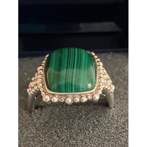 476 - SILVER RING with polished MALACHITE set to top. Beautiful SILVER beadwork surround. Complete with ri... 