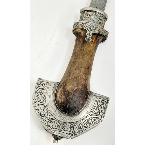 597 - An antique, very ornamental, white metal (untested) possibly Indian, ceremonial,  curved dagger with... 