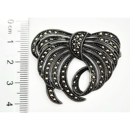 772 - A Vintage Marcasite and Silver Bow-Swirl Brooch. 4cm.