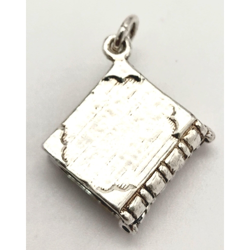 832 - A STERLING SILVER DIARY CHARM/PENDANT, WHICH OPENS UP, WEIGHT  4.8G