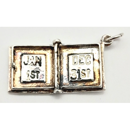 832 - A STERLING SILVER DIARY CHARM/PENDANT, WHICH OPENS UP, WEIGHT  4.8G