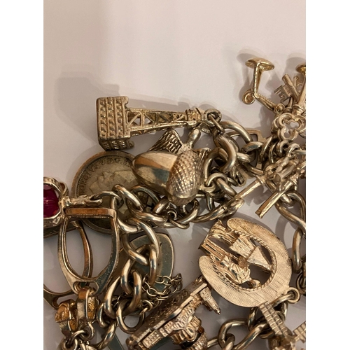 982 - Vintage SILVER CHARM BRACELET Having an interesting selection of charms dating from the 1920’s to th... 