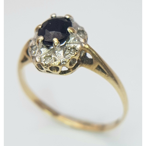 289 - A vintage 9 K yellow gold ring with an oval cut, dark blue sapphire surrounded by old cut diamonds, ... 