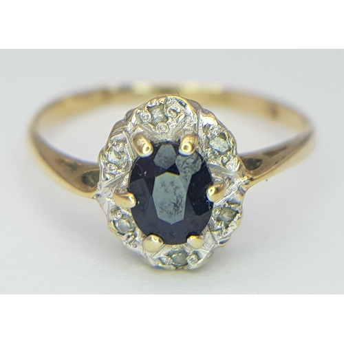 289 - A vintage 9 K yellow gold ring with an oval cut, dark blue sapphire surrounded by old cut diamonds, ... 