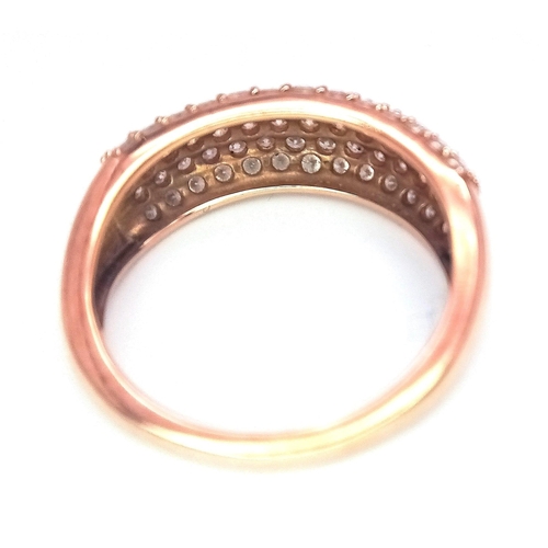 316 - A 9K Rose Gold Diamond Encrusted Ring. Five rows of 70 small cut round diamonds. Size N. 3.2g total ... 