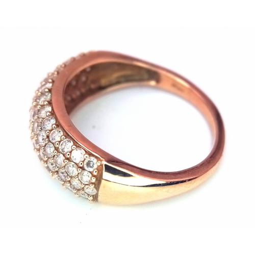 316 - A 9K Rose Gold Diamond Encrusted Ring. Five rows of 70 small cut round diamonds. Size N. 3.2g total ... 