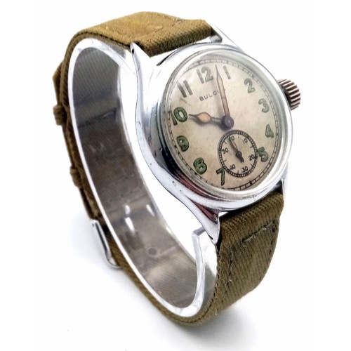 206 - A Vintage (1940s) Military Style Bulova Mechanical Gents Watch. Green textile strap. Stainless steel... 