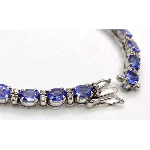 213 - A spectacular 18 K white gold bracelet with oval cut tanzanite gems and round cut diamonds. Length: ... 