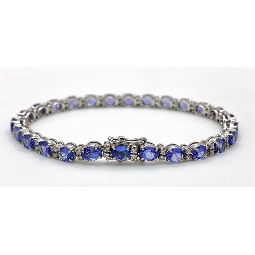 213 - A spectacular 18 K white gold bracelet with oval cut tanzanite gems and round cut diamonds. Length: ... 