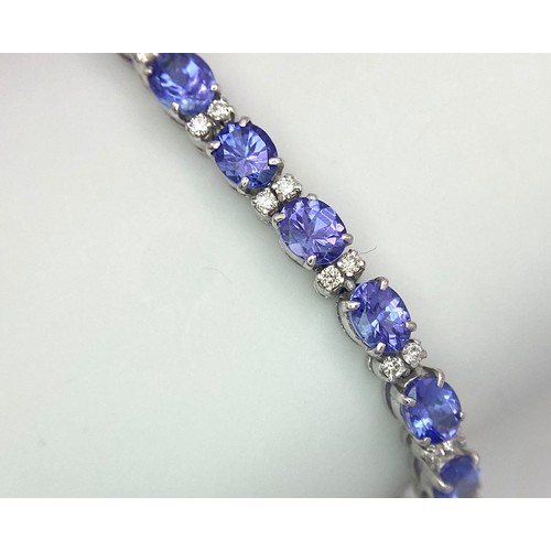 213 - A spectacular 18 K white gold bracelet with oval cut tanzanite gems and round cut diamonds. Length: ... 