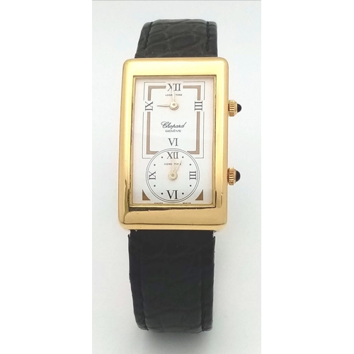 102 - A Chopard 18K Gold Home Time (Dual Time) Gents Watch. Black leather strap. 18K gold rectangular case... 