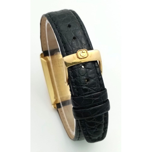 102 - A Chopard 18K Gold Home Time (Dual Time) Gents Watch. Black leather strap. 18K gold rectangular case... 