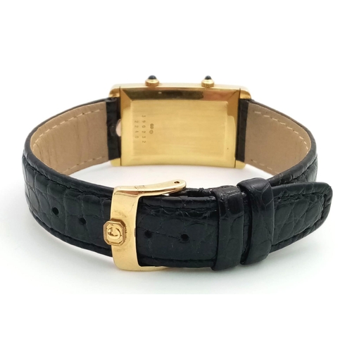 102 - A Chopard 18K Gold Home Time (Dual Time) Gents Watch. Black leather strap. 18K gold rectangular case... 