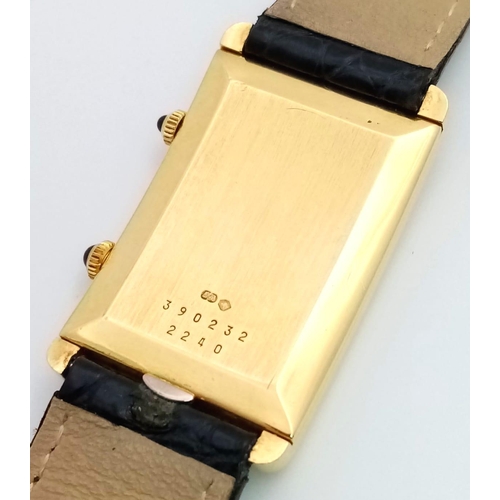 102 - A Chopard 18K Gold Home Time (Dual Time) Gents Watch. Black leather strap. 18K gold rectangular case... 