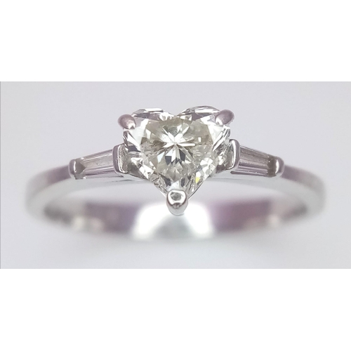 155 - An 18K White Gold and Diamond Solitaire Ring. A near white heart cut VS1 grade central diamond - 0.4... 