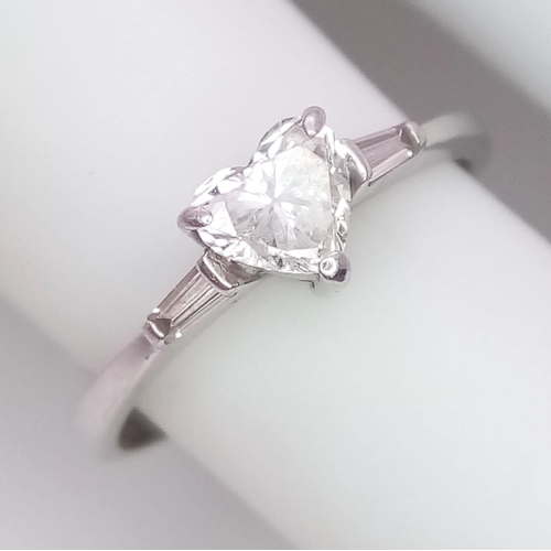 155 - An 18K White Gold and Diamond Solitaire Ring. A near white heart cut VS1 grade central diamond - 0.4... 