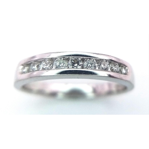 229 - 18K WHITE GOLD DIAMOND SET BAND RING, APPROX 0.20CT DIAMONDS TOTAL, WEIGHT 3.5G SIZE M