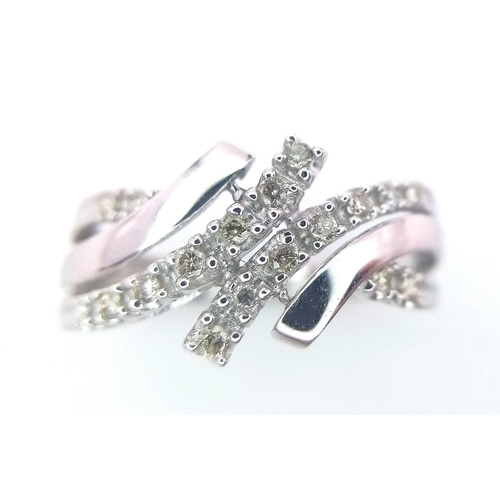 495 - A FANCY 9K WHITE GOLD DIAMOND CROSSOVER RING, APPROX 0.15CT DIAMONDS, WEIGHT 2.6G SIZE Q