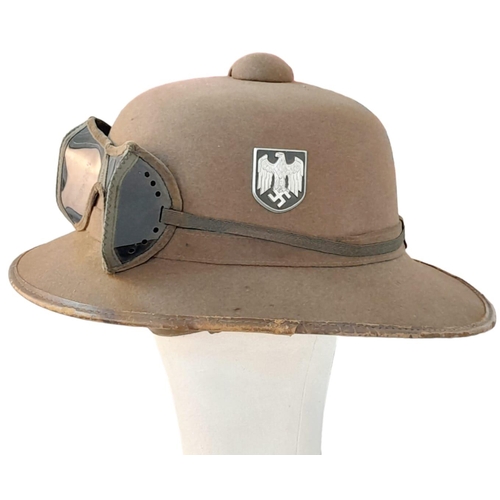 546 - WW2 Mk II German Africa Corps Tropical Helmet inc Sand Goggles. There is a small field repair to the... 