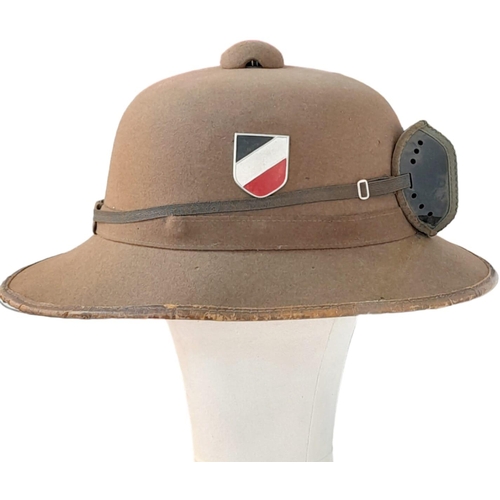 546 - WW2 Mk II German Africa Corps Tropical Helmet inc Sand Goggles. There is a small field repair to the... 