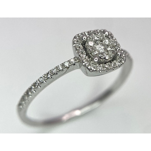 558 - A 9K WHITE GOLD STONE SET RING .   1.9gms   size N