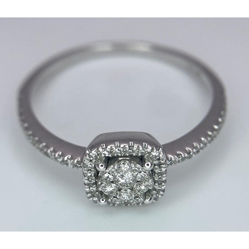 558 - A 9K WHITE GOLD STONE SET RING .   1.9gms   size N