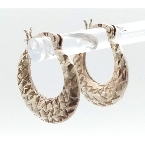 624 - A fancy pair of 925 silver hoop earrings. Total weight 2.85G.