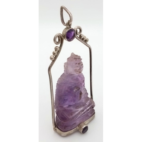 676 - A Unique Vintage Amethyst Silver Mounted Buddha/Deity Pendant. The Carved Buddha measures 4.5cm Long... 