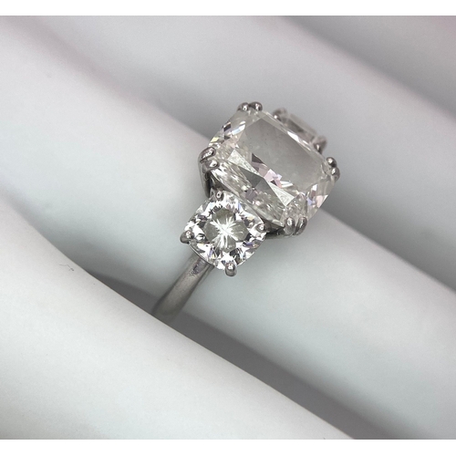 78 - A Breathtaking 4.01ct GIA Certified Diamond Ring. A brilliant cushion cut 4.01ct central diamond of ... 