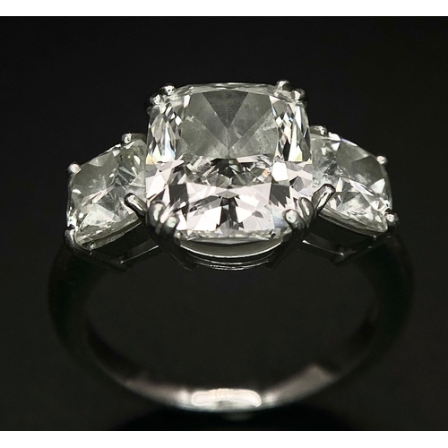 78 - A Breathtaking 4.01ct GIA Certified Diamond Ring. A brilliant cushion cut 4.01ct central diamond of ... 