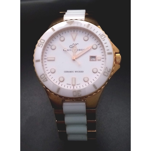 871 - A Klaus Kobec Ceramic Wicked Quartz Watch. White ceramic and gilded stainless steel bracelet and cas... 