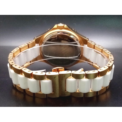 871 - A Klaus Kobec Ceramic Wicked Quartz Watch. White ceramic and gilded stainless steel bracelet and cas... 