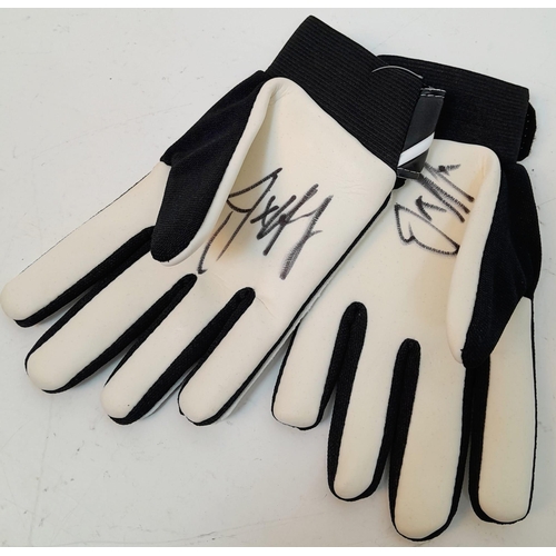 1059 - A Joe Hart Pair of Signed Goalkeeping Gloves. Signed at Man city training ground 2011.