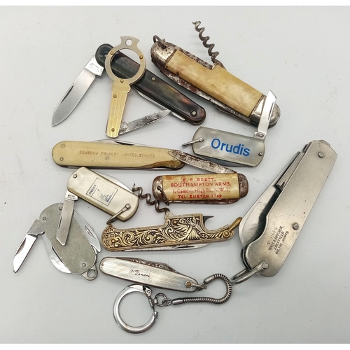 590 - A large group of folding knives, some antique, some modern, some with tools etc.